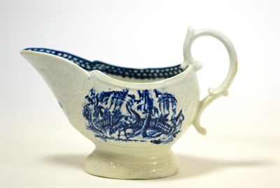 Lot 374 - A John and James Pennington moulded sauceboat, printed in underglaze blue with exotic birds in...