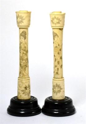 Lot 387 - A pair of Meji late 19th/early 20th century Japanese ivory candlesticks, 25cm high