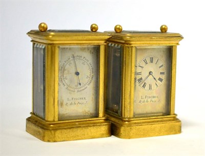 Lot 398 - A brass carriage timepiece and a aneroid barometer, both retailed by L.Fischer, R de la Prix, circa