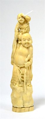 Lot 403 - A Japanese ivory okimono, early 20th century, of Budai standing holding a child on his...