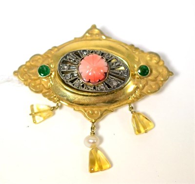 Lot 435 - A coral, emerald and citrine brooch, a yellow fancy oval frame set centrally with a carved...