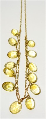 Lot 437 - A citrine necklace, graduated oval cut citrines on swag links, and a trace link chain, length...