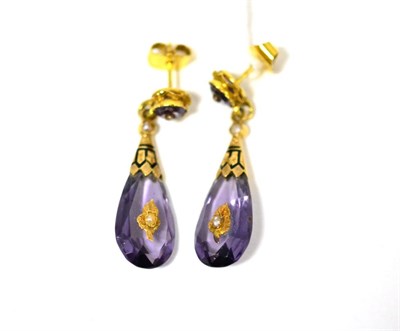 Lot 445 - A pair of amethyst and pearl drop earrings, the round cut amethyst in a crimped setting with a...