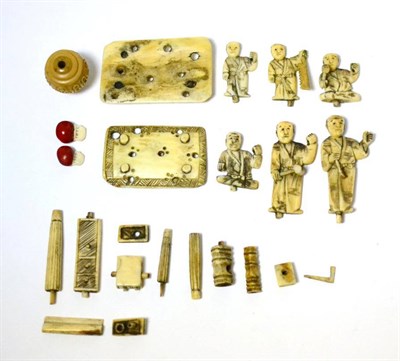 Lot 448 - A small group of late 19th/early 20th century Japanese ivory pieces, including two beans carved...