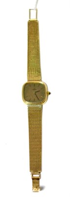 Lot 450 - A lady's 9ct gold wristwatch, signed Omega, 1972, lever movement, textured gilt dial with baton...