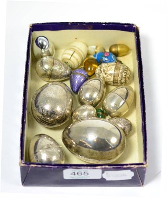 Lot 465 - Sixteen assorted silver, white metal and enamel egg caskets and thimble cases of assorted sizes