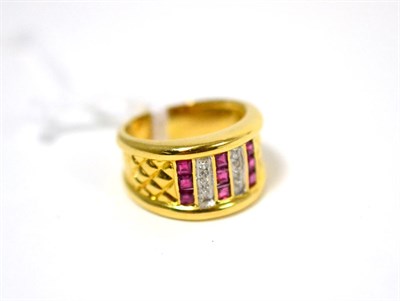 Lot 493 - A ruby and diamond ring, rows of calibré cut rubies alternate with diamonds, to crosshatch...