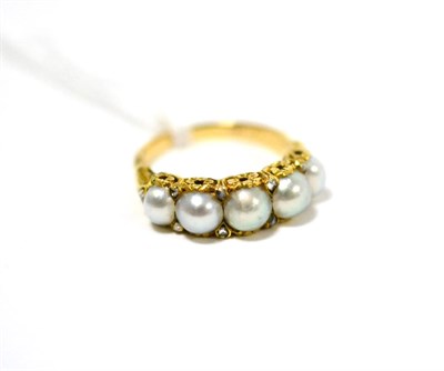 Lot 499 - A Victorian split pearl and diamond ring, five split pearls with pairs of rose cut diamond...