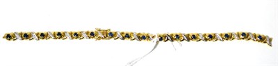 Lot 503 - A sapphire and diamond bracelet, of heart shaped links each set with a sapphire, alternating...