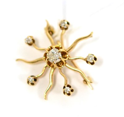 Lot 505 - A diamond star brooch, an old cut diamond centrally, within wavy radial arms, alternating arms with