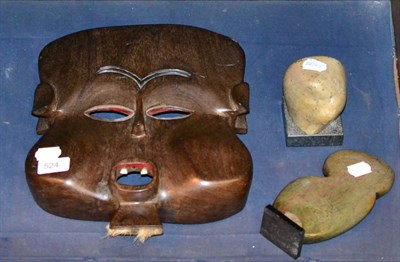 Lot 524 - A tribal mask stone carving and an Inuit carving