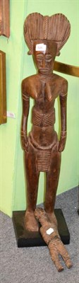 Lot 526 - A Baule maternity figure and a fetish figure probably Mbugu, Tanzania