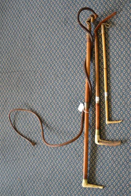 Lot 528 - A hunting whip with leather thong and two crops, all with antler handles