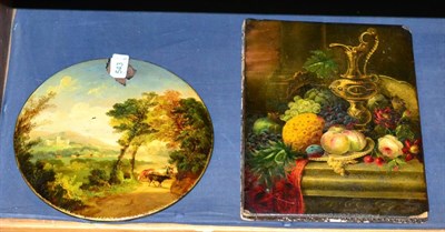 Lot 543 - A papier mâché stationary pad painted with a chalice and fruit and a papier mâché roundel...