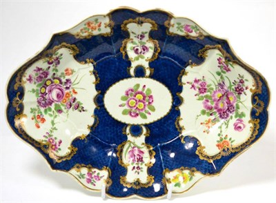 Lot 545 - A First Period Worcester blue scale ground dessert dish, painted with flower sprays, 31cm