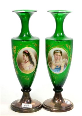 Lot 564 - A pair of Victorian green glass vases, each painted with a relief oval portrait panel, with...