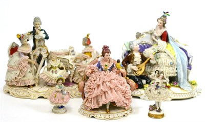 Lot 566 - Five various Continental porcelain crinoline figures and figure groups