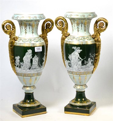 Lot 588 - A pair of 20th century green ground gilt decorated Campana shaped vases, 46cm high