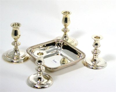 Lot 606 - Two pairs of sterling silver candlesticks and a serving dish stamped .800