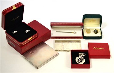 Lot 608 - A pair of Cartier cufflinks, another pair of cufflinks, a Must de Cartier cocktail swizzle stick, a