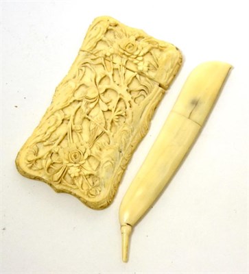 Lot 631 - A late 19th century Chinese small ivory calling card case, one side carved with a bird perched...