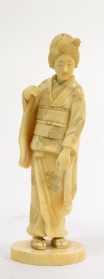 Lot 639 - A Japanese Meiji period ivory okimono of a geisha girl (a.f.)