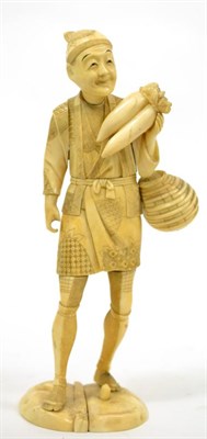 Lot 640 - A Japanese Meiji period ivory okimono of a market seller (a.f.)