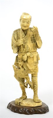 Lot 641 - A Japanese Meiji period ivory okimono of a market seller (a.f.)