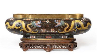 Lot 645 - An early 20th century Chinese cloisonne bowl of elongated quatrefoil form, hardwood stand