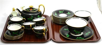 Lot 652 - A Wedgwood part tea service on a black ground decorated with Dogs of Fo