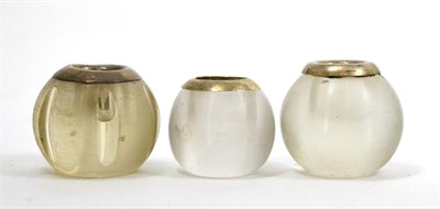 Lot 664 - Three glass match strikes and holders of ribbed circular form with silver collars (3)