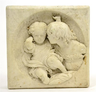 Lot 665 - Carved marble plaque with sectional circular brass relief panel of mother and child, 19cm by 19cm