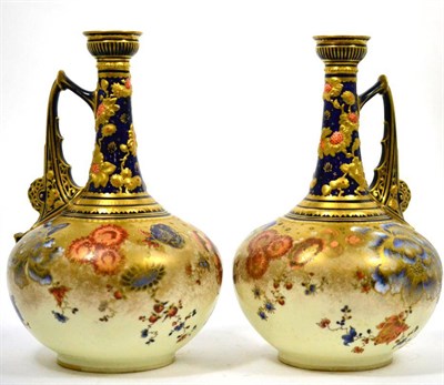 Lot 672 - A pair of Royal Crown Derby ewer style vases decorated in blue gilt with flowers, 25cm high