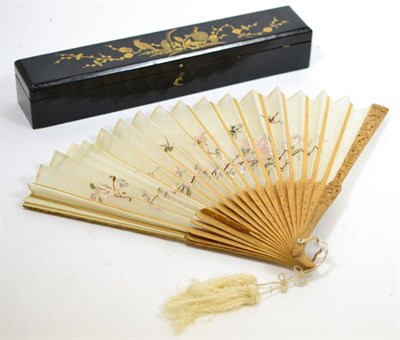 Lot 684 - A Cantonese sandalwood fan with embroidered gauze leaf in a lacquered box