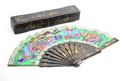 Lot 685 - A Cantonese ";Thousand Face"; fan with lacquered sticks and guards in a lacquered box