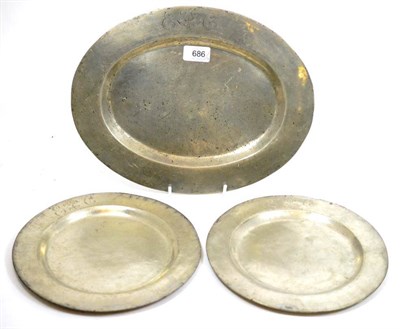 Lot 686 - Of Eton College interest: An oval platter and two dishes, 18th century pewter, bearing E C...