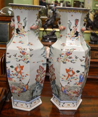 Lot 691 - A pair of Chinese Canton hexagonal section floor vases, 60cm high