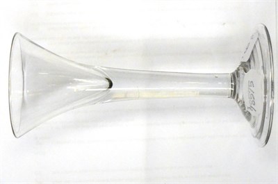 Lot 692 - An 18th century wine glass, the trumpet bowl on a plain stem and folded foot, 17cm high