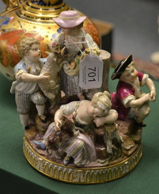 Lot 701 - A late 19th century Meissen porcelain figure group as five children with a dog and lambs on a mount