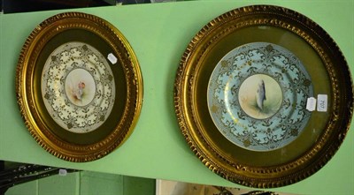 Lot 707 - A pair of framed signed porcelain plates (duck and fish)