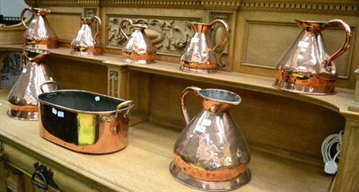 Lot 714 - A group of seven 19th century copper harvest jugs