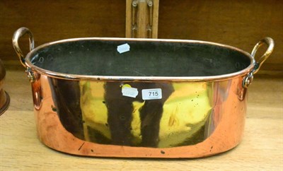 Lot 715 - A 19th century twin-handled copper pan