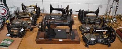 Lot 719 - Eight late Victorian black and gilt decorated hand sewing machines