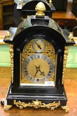 Lot 737 - An ebonised chiming table clock, circa 1900, gilt metal mounts, side sound frets, scroll feet, pull