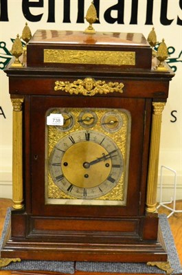 Lot 738 - A mahogany chiming table clock, circa 1890, pineapple finials, gilt metal mounts, side carrying...