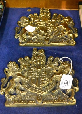 Lot 787 - A pair of brass coats of arms, 16.7cm high  Provenance: By repute Trawsgoed Mansion