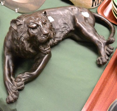 Lot 799 - Japanese bronze figure of a tiger, Meiji period, realistically modelled recumbent with head raised