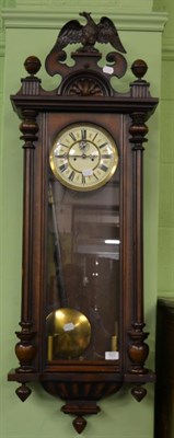 Lot 825 - A 19th century Vienna wall clock with eagle pediment above ball finials and fluted split...