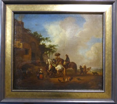 Lot 1098 - Manner of P Wouwermans (1619-1668) Figures shoeing a horse outside an inn with other figures...