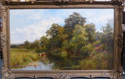 Lot 1118 - Walter Wallor Caffyn (1845-1898) Cattle watering in an extensive summer landscape, signed and dated